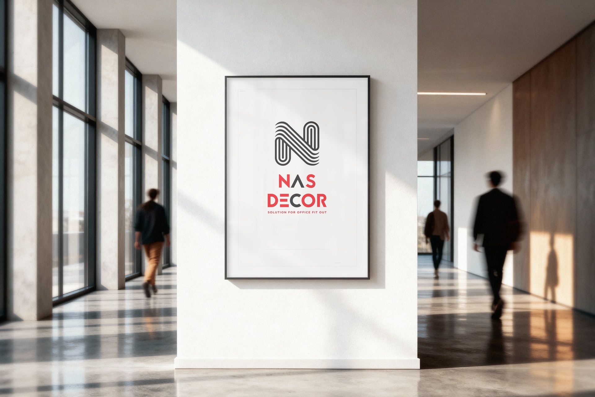 NAS Decor poster mounted on a wall in a modern corporate hallway